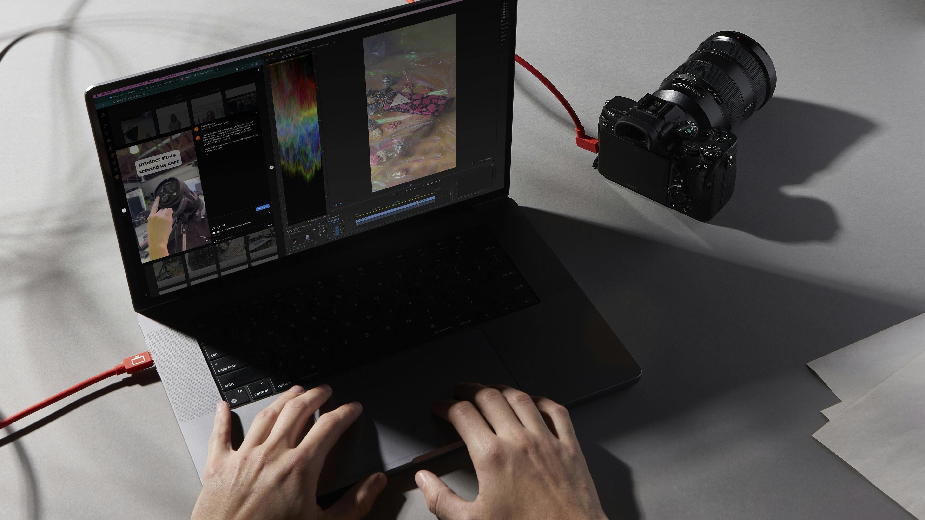 MacBook Pro on a desk tethered to a sony camera